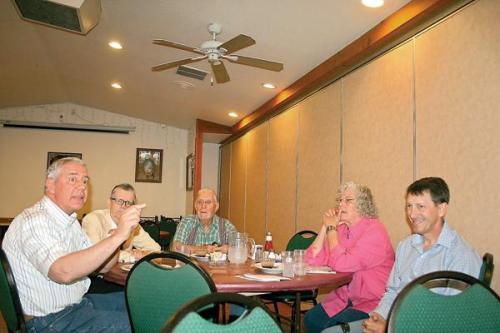 Weld County District Attorney Ken Buck, left, visited with a few people at the Country Steak Out restaurant on Tuesday during a listening tour across the plains. He is running to become the Republican nominee for Congressional District 4, which includes Morgan County. (Dan Barker/ Fort Morgan Times)